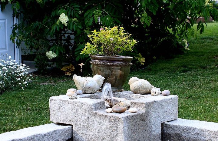 learn how to assemble this laguna deck pond plus fountain tips, outdoor living, ponds water features, Fountain decorated with colorful stones and plants