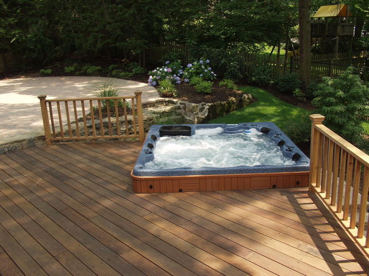 do you like hot tubs on a deck or built in, Our client had an unusable sloping rear yard We added a mahogany deck with rails and a built in hot tub