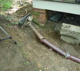 video repairing a clay drain pipe, damaged clay downspout leader