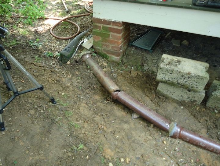 video repairing a clay drain pipe, damaged clay downspout leader