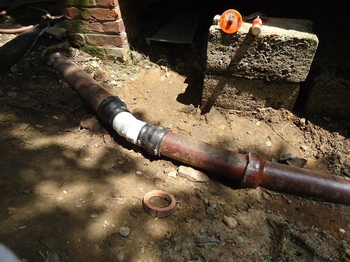 video repairing a clay drain pipe, home maintenance repairs, plumbing, clay pipe with fernco repair