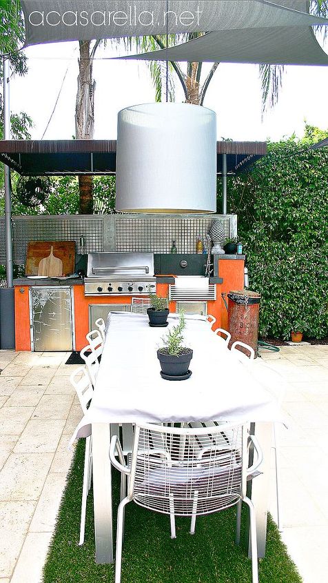 tropical industrial home tour, home decor, outdoor living, pool designs, The outdoor table seats ten and the outdoor kitchen is fully functional