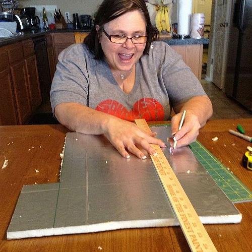 diy cornices for bedroom no wood or hammer needed, bedroom ideas, diy, home decor, how to, And me cutting I m having so much fun P S DO NOT look at my kitchen counters in the background