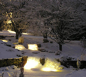 create a cozy winter water garden, gardening, lighting, outdoor living, ponds water features, Snow has covered the waterfall lights creating a magical glow