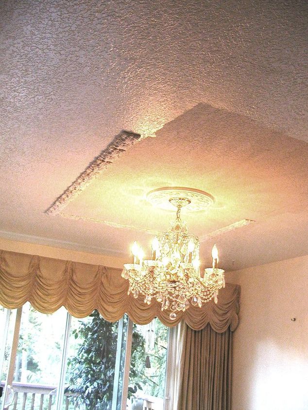 easy diy ornamental plaster ceilings, home decor, lighting, As the pieces are cast with plaster of paris and dry joint compound is spread over the back of each piece as the adhesive and then held in place for 60 seconds