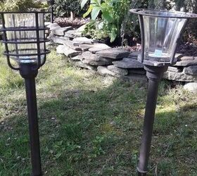 She takes the top off a solar light for the coolest garden hack yet