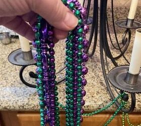 Hang Mardi Gras beads on an old chandelier for a genius $5 upgrade