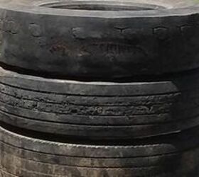 This couple stacks 4 tires on their lawn for a shockingly beautiful garden feature