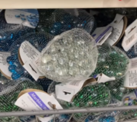 She uses a bag of Dollar Tree marbles to add brilliant bathroom storage
