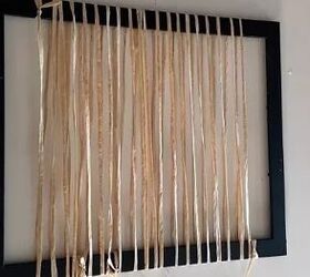 She wraps raffia around a picture frame and weaves it into a mat to make something incredible for summer