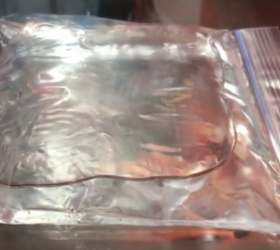 She puts a bag of rubbing alcohol in the freezer for a clever trick