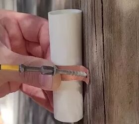 She cuts up a PVC pipe and screws the pieces into her garden fence for a clever idea