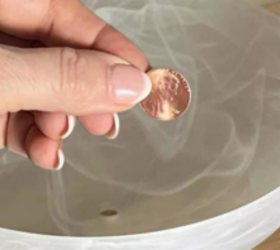 She places a penny in the center of her glass light fixture for this stunning outdoor idea