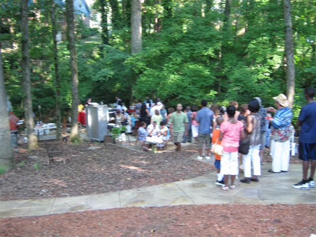 community party ppl where asking how i utilize space we give back by having an, line to the smoker grill along creek translation baby back ribs seafood area
