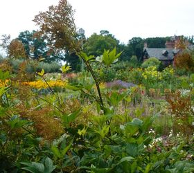 stan hywet s great garden part 2 the cutting garden, flowers, gardening, landscape, Looking over the Cutting Garden to the Hall The dried flower spikes of Filipendula in the forefront is part of the north perennial border that separates the Cutting Garden from the rest of the Great Garden