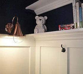 closet turned reading nook and toy storage, bedroom ideas, closet, lighting, shelving ideas, storage ideas, woodworking projects, Sconce added by running a cord around the molding and plugging it into the outlet outside the closet