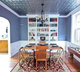 fun dining room makeover with a tin ceiling, dining room ideas, home decor, home improvement, tiling, It s fun to see the transformation of the space and how much the crown wainscot panels chair rail and tin ceiling adds to it The 2 doors flanking the bookcase were built in to the wall design to conceal them