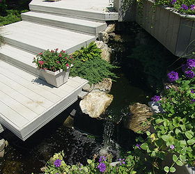 micro pond installed to ceate movement and sound in a former planting bed, decks, gardening, outdoor living, patio, ponds water features, stairs, Trex deck and platform stairs with an Aquascape micro pond in a former planting bed