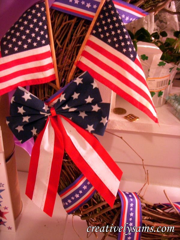 patriotic wreath tutorial, crafts, patriotic decor ideas, seasonal holiday decor, wreaths, Add bow 2 4 x6 flags with hot glue