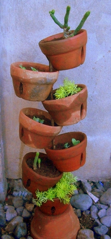 diy terra cotta pot collage, gardening, succulents, just stack them all up transplant your greens or blooms and it s ready for the yard