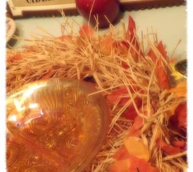 a fall table setting full of whimsy, home decor, A piece of caramel glass is sitting idle in the middle of a raffia leaf wreath just waiting to be filled with fresh watermelon