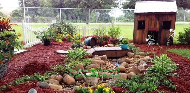 re purposed backyard, gardening, repurposing upcycling, Vintage Paws memorial garden with pallet bridge and pallet doghouse