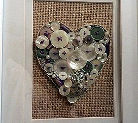 button art, crafts, repurposing upcycling, BUTTON ART ON BURLAP MUSLIN BACKGROUND THE HEART EDGE IS BRAIDED JUTE TWINE BUTTONS ARE ACCENTED WITH PURPLE EMBROIDERY FLOSS STITCHING WHITE AND SILVER BUTTONS PEARLS AND PURPLE STONES WERE GLUED ONTO THE BURLAP