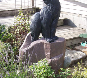 restoring a 65 year old cement statue, crafts, diy, how to, This is him as a black bear in the garden last year
