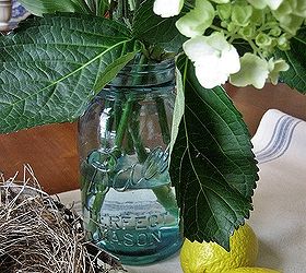 mason jars and bird nests a simple summer centerpiece, home decor, seasonal holiday decor, My vintage blue mason jar serves as a vase for a bouquet of summery flowers