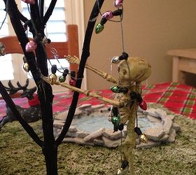 haunted christmas village, crafts, seasonal holiday decor, Skeleton decorating the tree