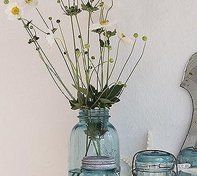 a bit of nautiical decorating with blue mason jars and flowers, home decor, A large mason jar makes a wonderful vase