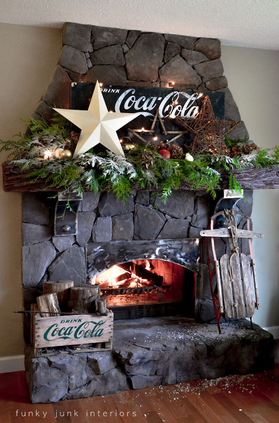 revamping an outdated brick fireplace without destruction, concrete masonry, fireplaces mantels, home decor, The end result is a cozy large scale rock fireplace that s a little funky a little old world and a whole lotta fun to decorate