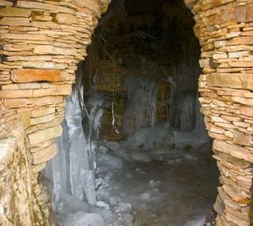 explore an icy waterfall and grotto in st charles illinois, ponds water features, The entrance to the grotto shows the intricate rock work pieced together by hand by a group of Certified Aquascape Contractors