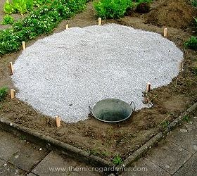 how to build a herb spiral garden, diy, flowers, gardening, homesteading, how to, perennial, Gravel base laid pond put into position Ready to build the vertical herb spiral structure