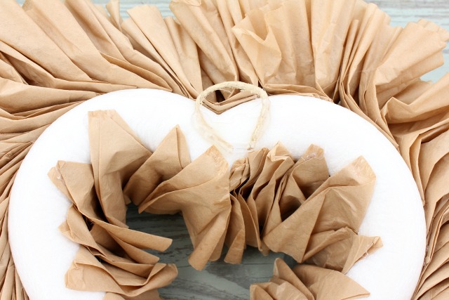 how to make a heart shaped coffee filter wreath, crafts, seasonal holiday decor, wreaths, Hot glue some twine to the back for a hanger You can also see how I glued the inside row of filters