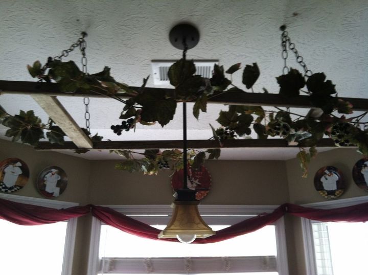 an old rustic ladder put back to use, home decor, repurposing upcycling, Added more grapes today acually and still in process to add more vine Steps were removed to easily place underneath the light fixture You could add the steps back if needed or wanted Maybe to add other props or visual pieces