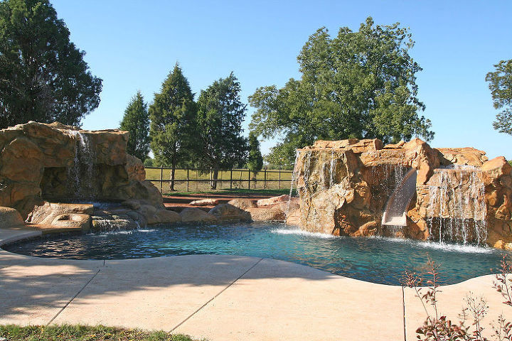 swimming pool waterfalls swimming pool water features swimming pools, outdoor living, ponds water features, pool designs, spas, Swimming Pool Waterfall built with a Grotto and Spa Backyard waterfalls and Backyard Water Slide compliment this Backyard Swimming Pool Water Feature with lighting design Swimming Pool Waterfall Design Ideas
