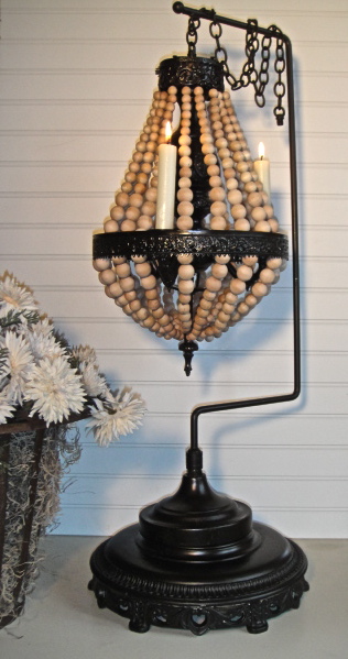 wood ball chandelier, crafts, lighting, Find the tuna can This was made with 600 wood balls or beads old chandelier parts old mirror parts and a tuna can No electrical wiring just candles