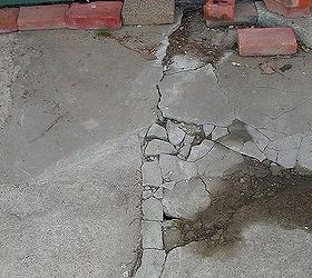 how can i salvage a crumbling cracked 24x24 triangle shaped concrete patio without, long crack from patio door across length of patio