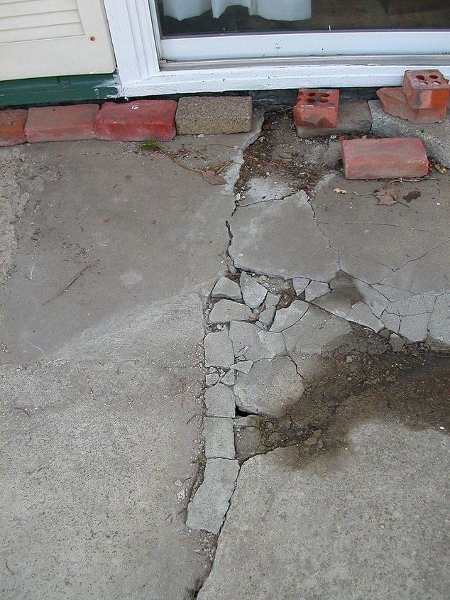 q how can i salvage a crumbling cracked 24x24 triangle shaped concrete patio without, concrete masonry, doors, home maintenance repairs, how to, patio, long crack from patio door across length of patio