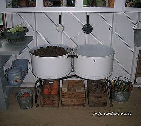 my potting shed my favorite place to be in the summer, container gardening, flowers, gardening, home decor, outdoor living, Old double porcelain laundry tubs make great containers for potting soil The sm enamelware pans hanging on the wall are used to scoop out the soil
