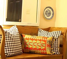 a different rug adds a pop of color to a small space, flooring, foyer, home decor, window treatments, I wanted to emphasize the navy color and so I made some navy and cream pillows and added a kilim pillow to the bench