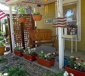 q porch in transition, diy, gardening, outdoor furniture, outdoor living, painted furniture, porches, I really really like this end of the porch The trellis defines the space