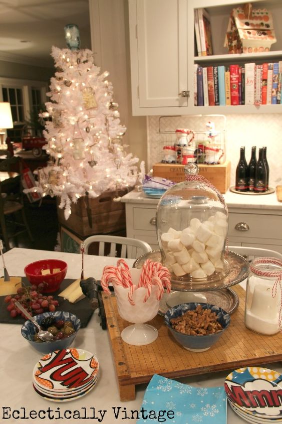 stress free party tips, cleaning tips, 5 Simple Decorations 4 Candles Elevate something simple to give it importance like this cloche from Wayfair filled with marshmallows My white Christmas also from Wayfair tree full of vintage mason jars is the focal point