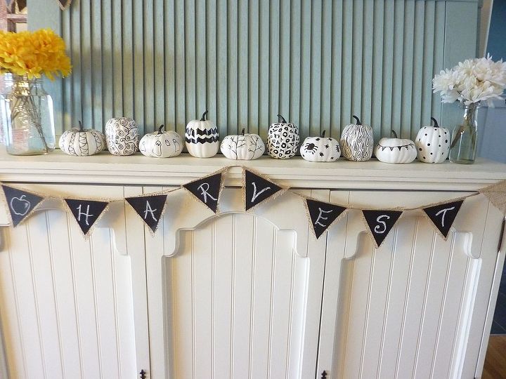 black and white oil sharpie pumpkins, crafts, seasonal holiday decor, oil sharpie pumpkins lined up along the mantel