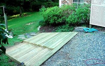 The homeowner needed an easily accessible walk and ramp to get her mowers and yardsale items from the back to the