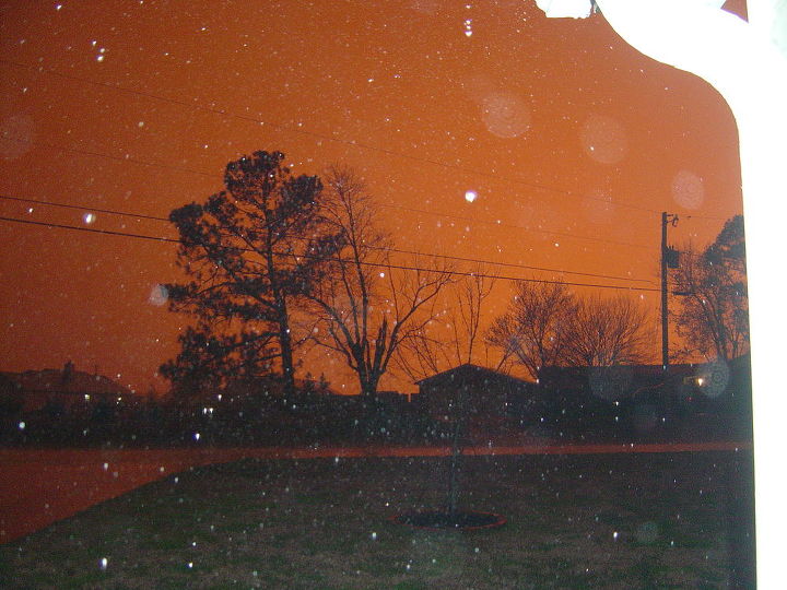 the sky went from orange to red and was hailing in the orange and ouring rain in the, outdoor living, from orange to red