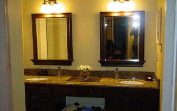 replaced a sheet mirror,stained cabinets, new lighting, new granite countertop and fixtures