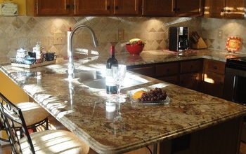 One of my favorite exotics : Typhoon Bordeaux, French Ogee edge profile, tumbled 4x4 tile backsplash