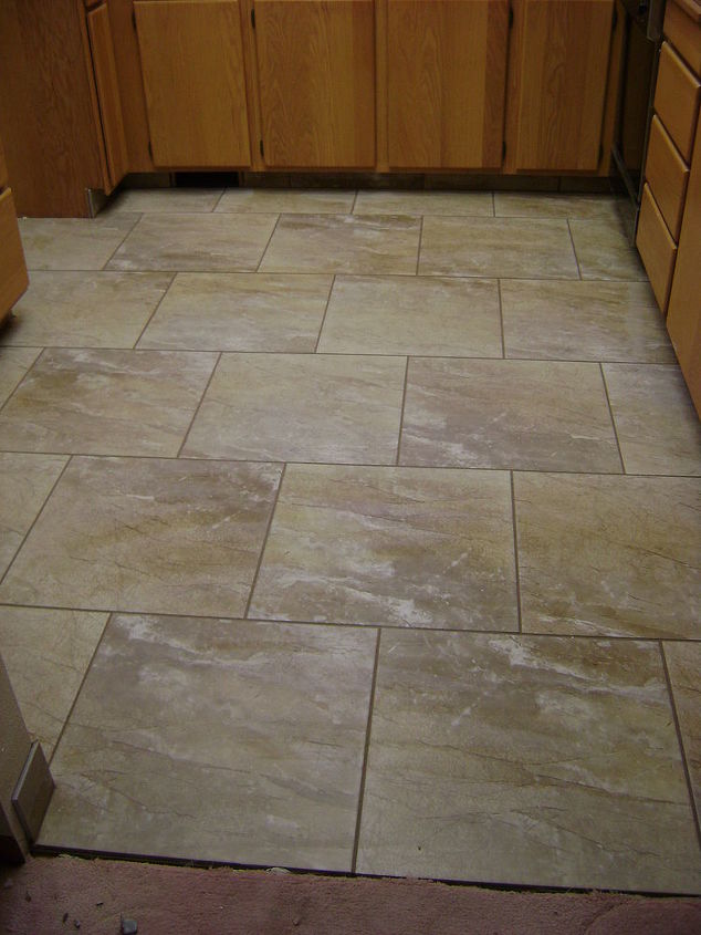 one broken piece of tile at a time this job took 5 days, bathroom ideas, kitchen design, tiling, 18x18 Porcelain tile stagger or brick lay pattern